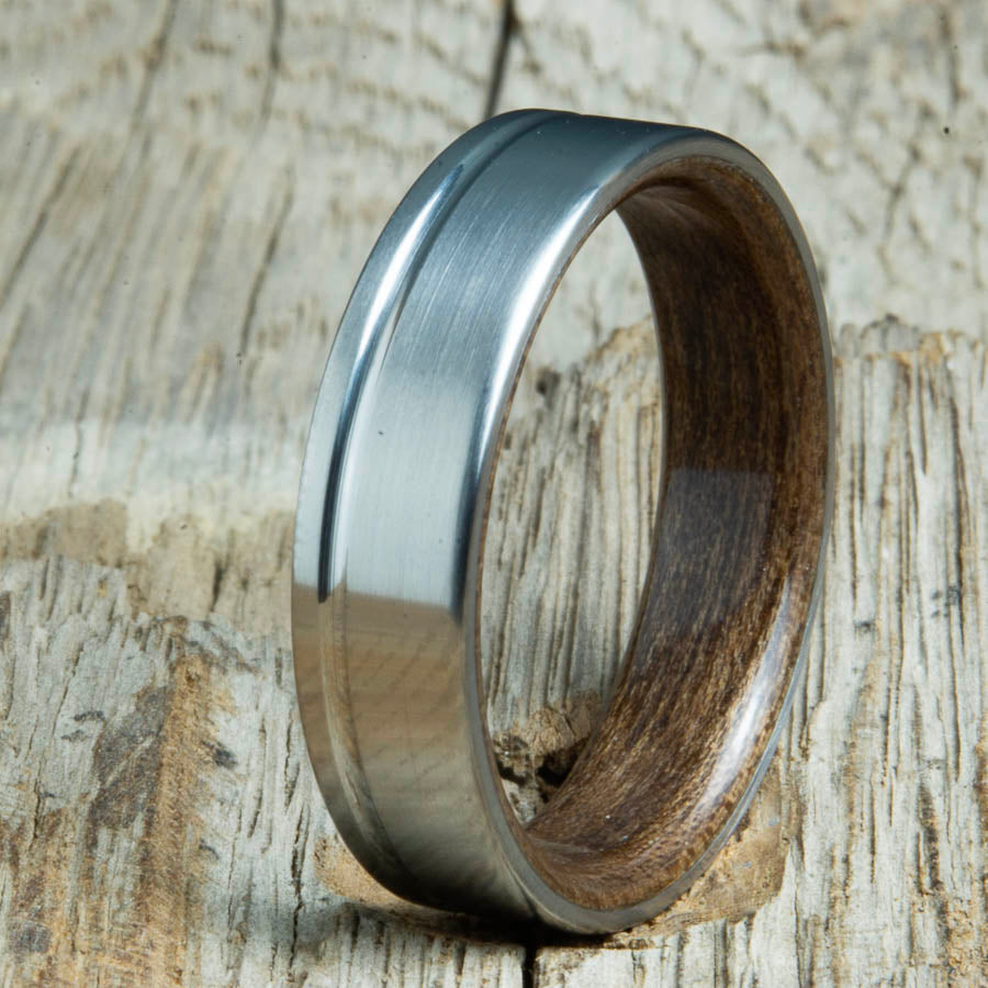 Single grooved pinstripe satin titanium mens ring with Acacia wood. Unique mens rings with wood and titanium made by Peacefield Titanium.