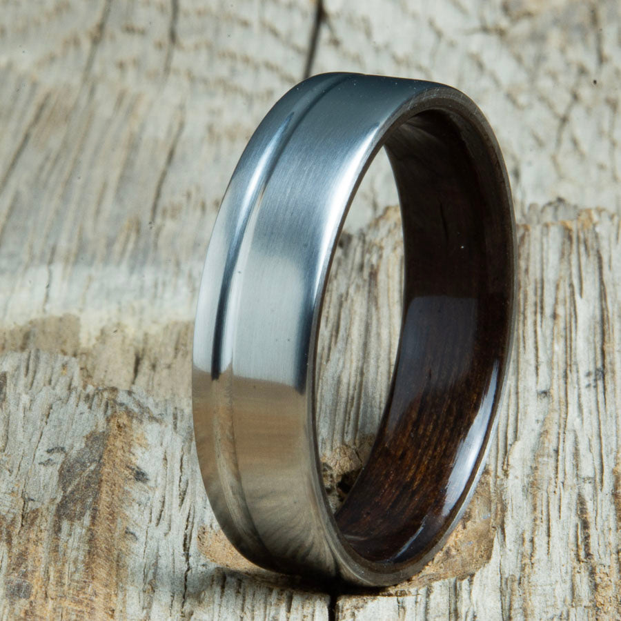 Single grooved pinstripe satin titanium mens ring with Rosewood wood. Unique mens rings with wood and titanium made by Peacefield Titanium.