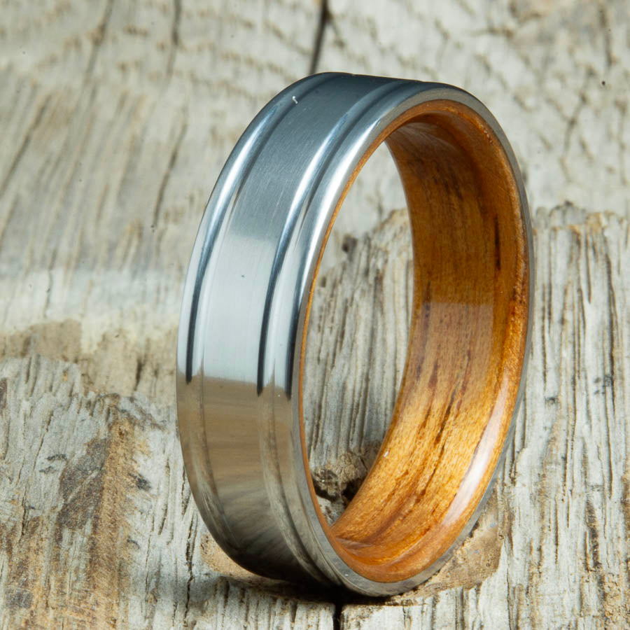 Double groove satin titanium wood ring with Hawaiian Koa interior. Unique handcrafted wedding rings made by Peacefield Titanium