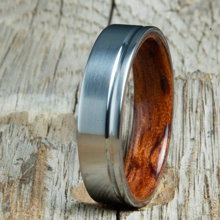 Single grooved pinstripe satin titanium mens ring with Bubinga wood. Unique mens rings with wood and titanium made by Peacefield Titanium.