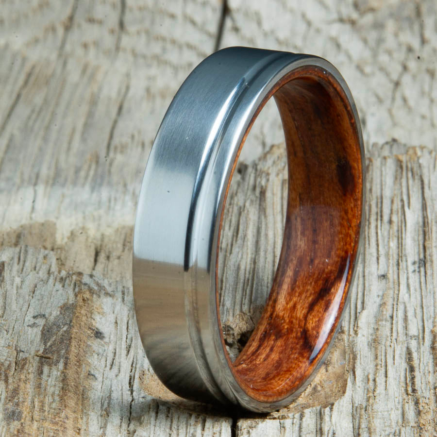 Single grooved pinstripe satin titanium mens ring with Bubinga wood. Unique mens rings with wood and titanium made by Peacefield Titanium.