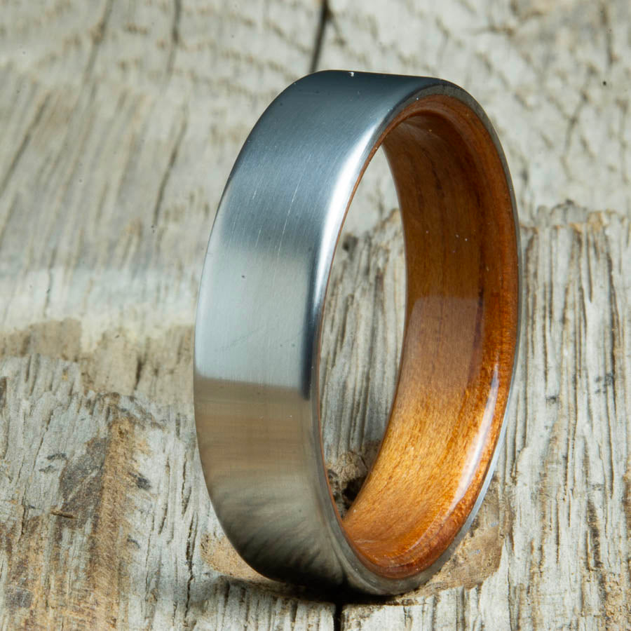 Mens rings with satin titanium and Hawaiian Koa wood interior. Unique Mens rings and wedding bands handcrafted by Peacefield Titanium