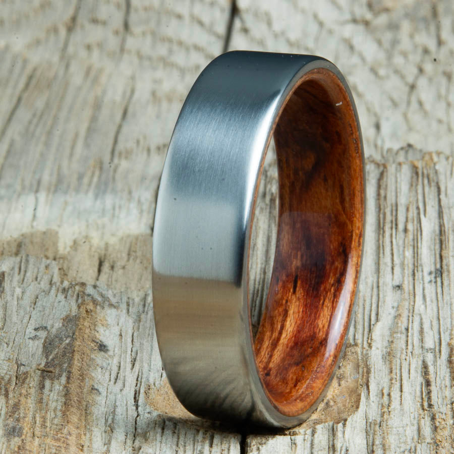 Mens rings with satin titanium and Bubinga wood interior. Unique Mens rings and wedding bands handcrafted by Peacefield Titanium
