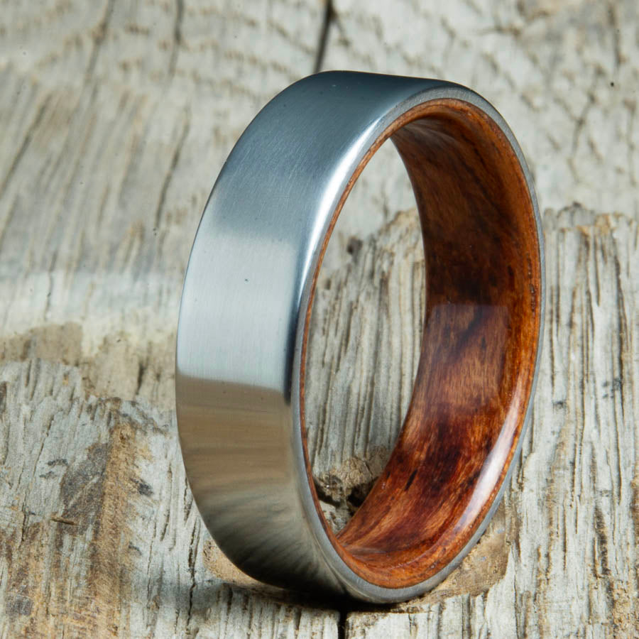 Mens rings with satin titanium and Bubinga wood interior. Unique Mens rings and wedding bands handcrafted by Peacefield Titanium