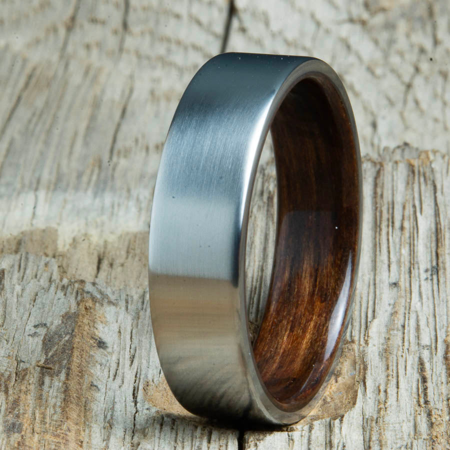 Mens rings with satin titanium and Ebony wood interior. Unique Mens rings and wedding bands handcrafted by Peacefield Titanium