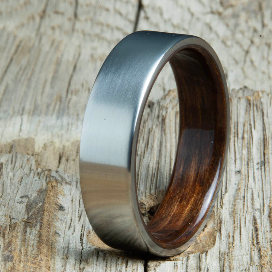 Mens rings with satin titanium and Ebony wood interior. Unique Mens rings and wedding bands handcrafted by Peacefield Titanium