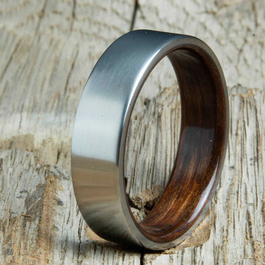 Mens rings with satin titanium and Ebony wood interior. Unique Mens rings and wedding bands handcrafted by Peacefield Titanium
