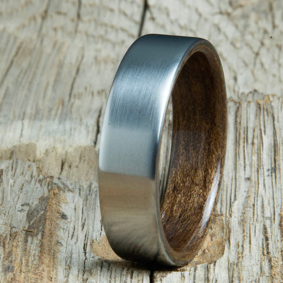 Mens rings with satin titanium and Walnut wood interior. Unique Mens rings and wedding bands handcrafted by Peacefield Titanium