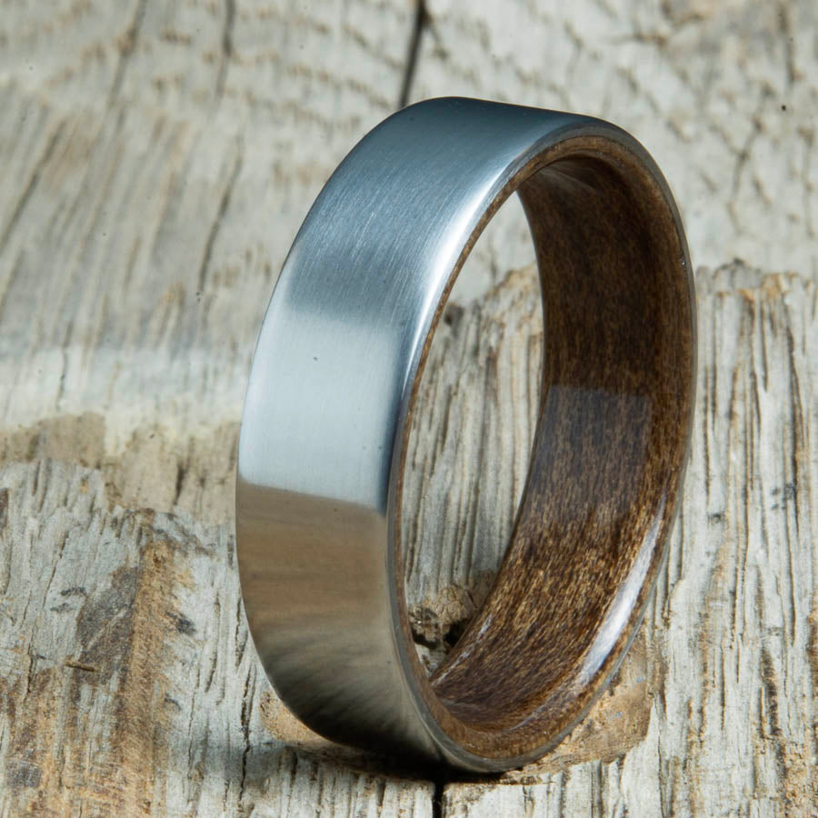 Mens rings with satin titanium and Walnut wood interior. Unique Mens rings and wedding bands handcrafted by Peacefield Titanium
