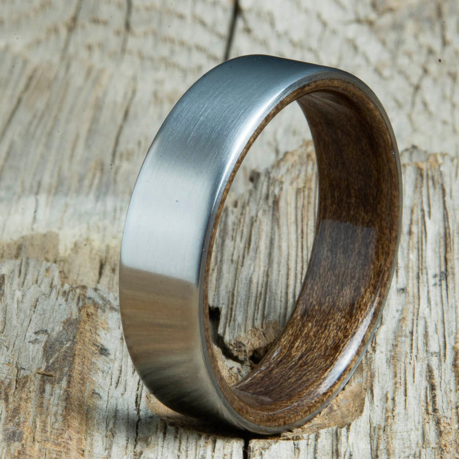 Mens rings with satin titanium and Walnut wood interior. Unique Mens rings and wedding bands handcrafted by Peacefield Titanium