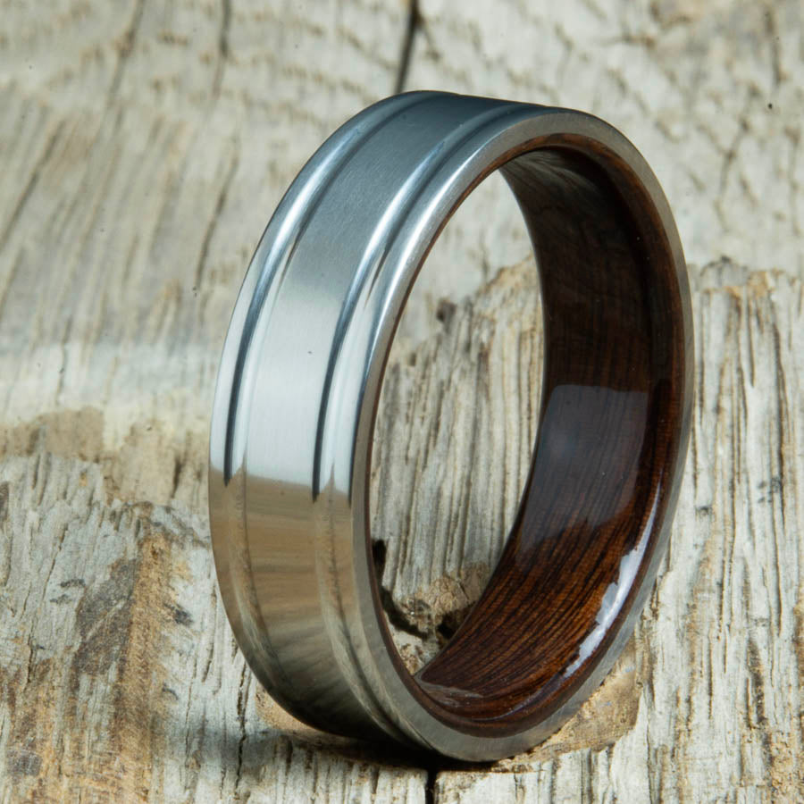 Double groove satin titanium wood ring with Rosewood interior. Unique handcrafted wedding rings made by Peacefield Titanium