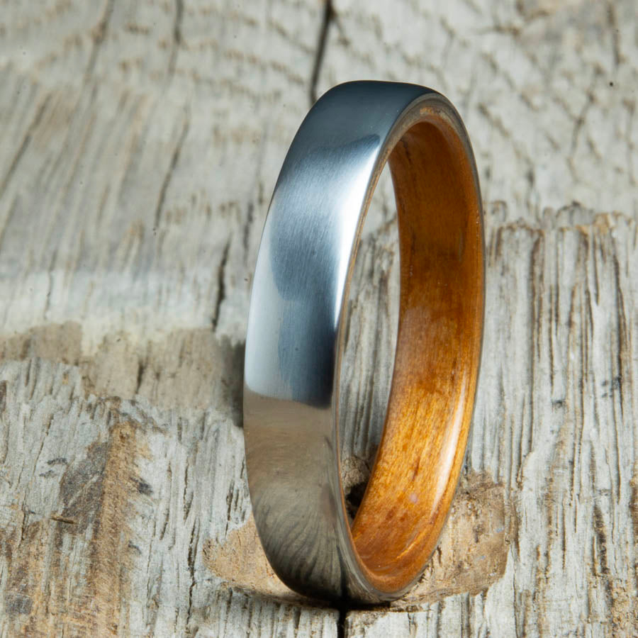 Hawaiian Koa wood lined womens wood ring with satin titanium. Custom handcrafted womens wooden rings are made by Peacefield Titanium