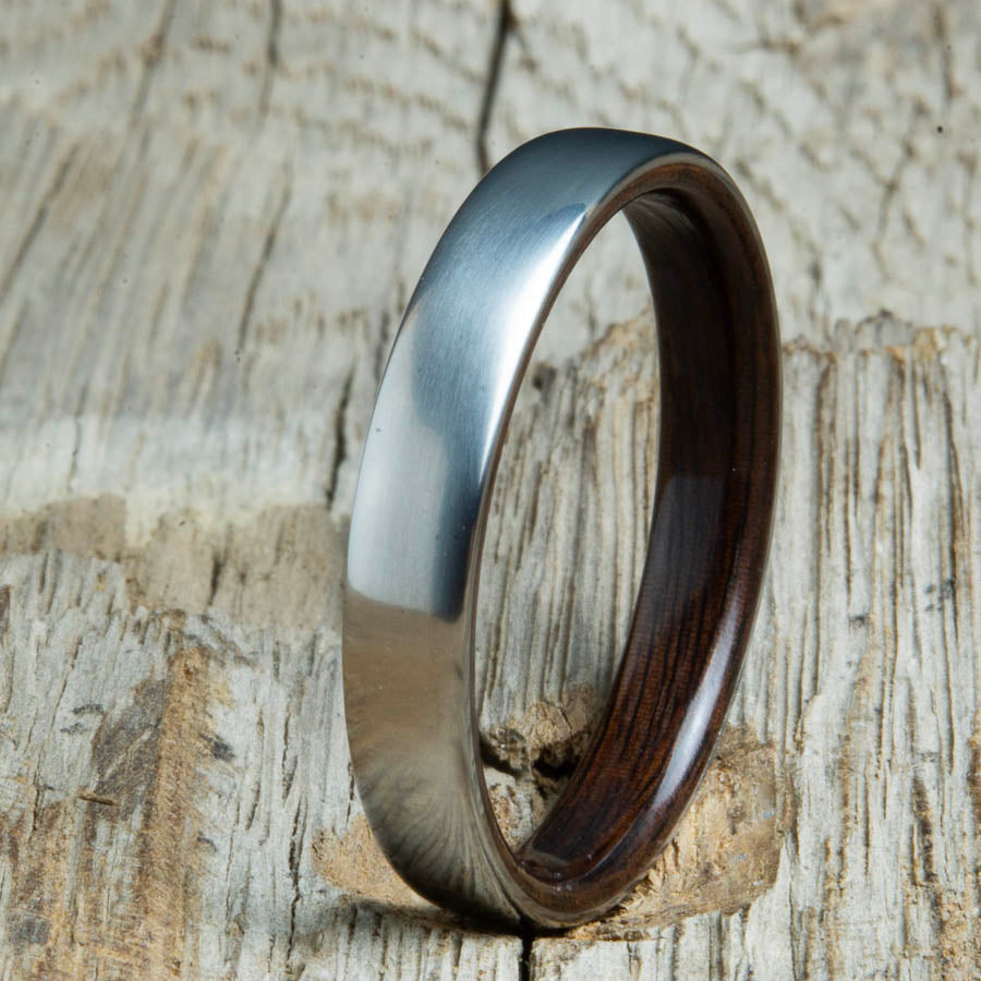 Rosewood lined womens wood ring with satin titanium. Custom handcrafted womens wooden rings are made by Peacefield Titanium