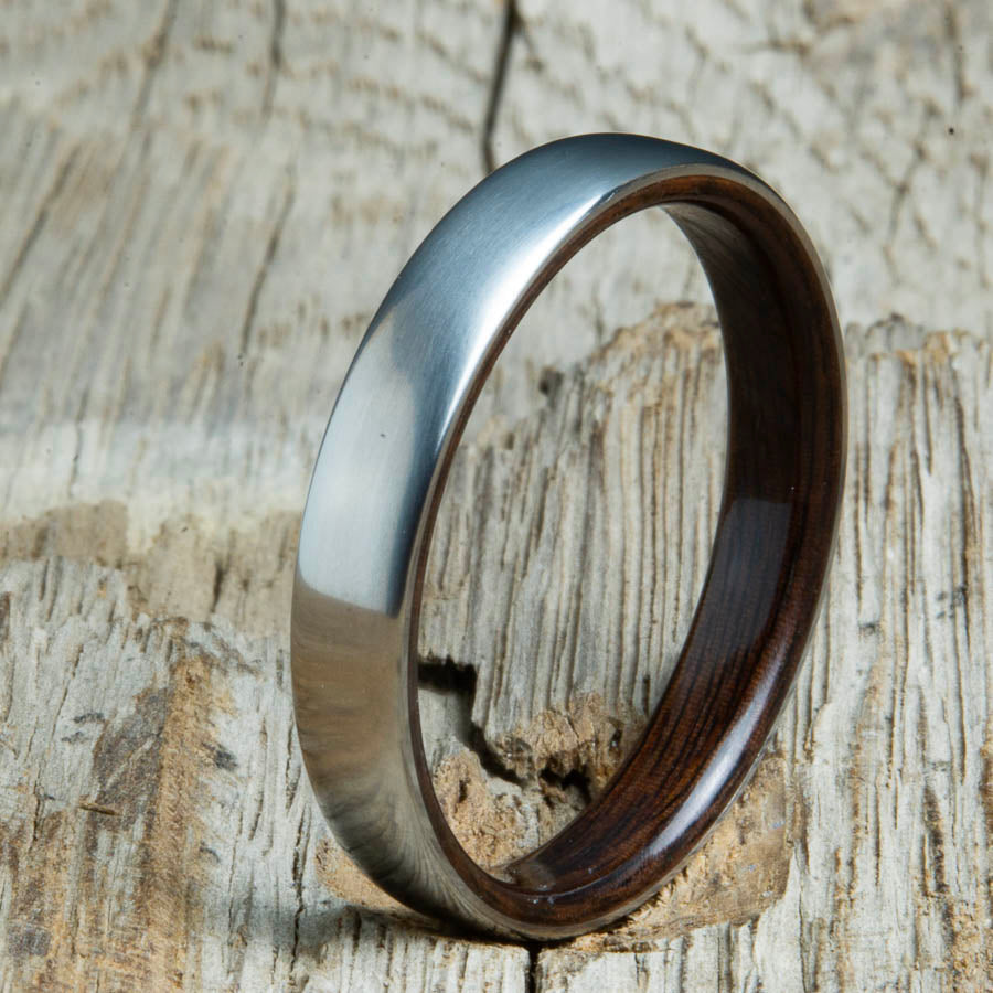 Rosewood lined womens wood ring with satin titanium. Custom handcrafted womens wooden rings are made by Peacefield Titanium