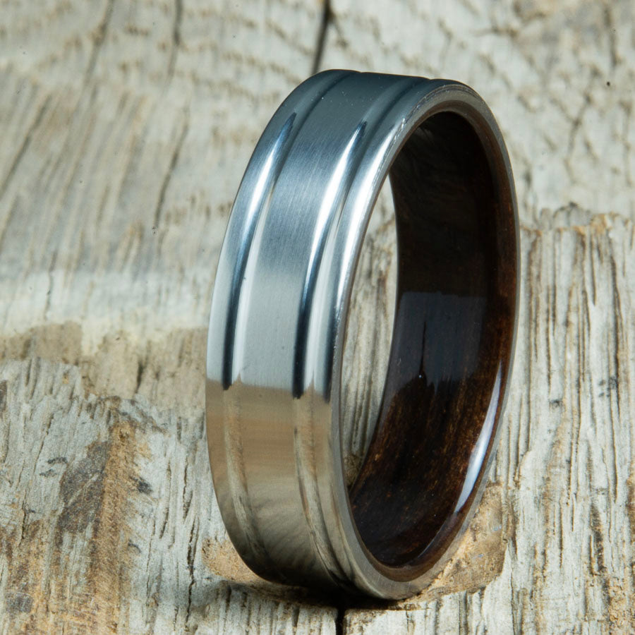 Double groove satin titanium wood ring with Ebony wood interior. Unique handcrafted wedding rings made by Peacefield Titanium