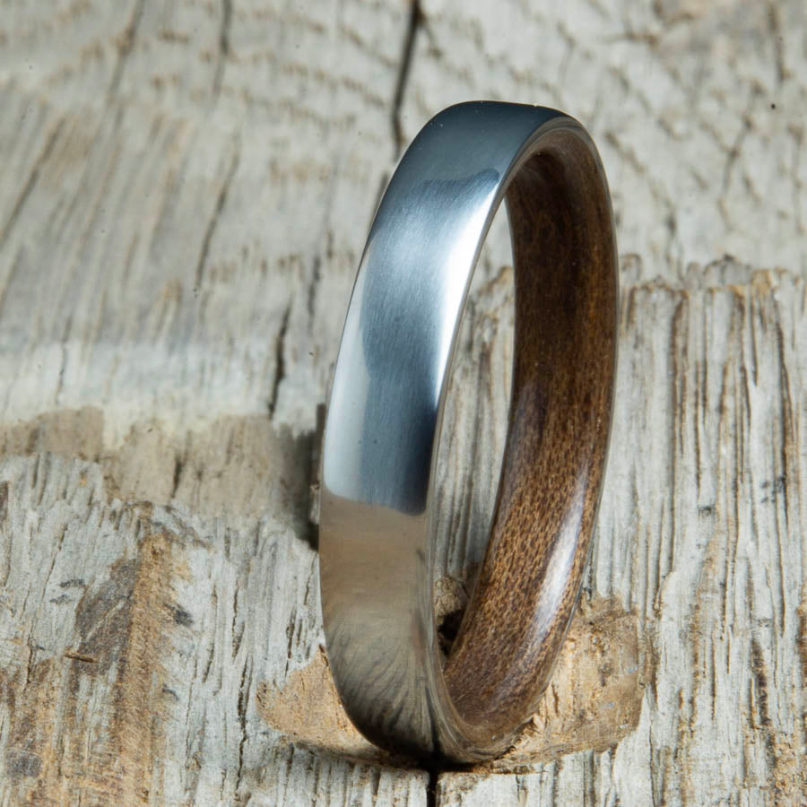 Walnut lined womens wood ring with satin titanium. Custom handcrafted womens wooden rings are made by Peacefield Titanium