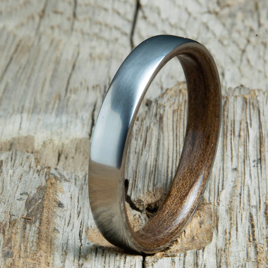 Walnut lined womens wood ring with satin titanium. Custom handcrafted womens wooden rings are made by Peacefield Titanium