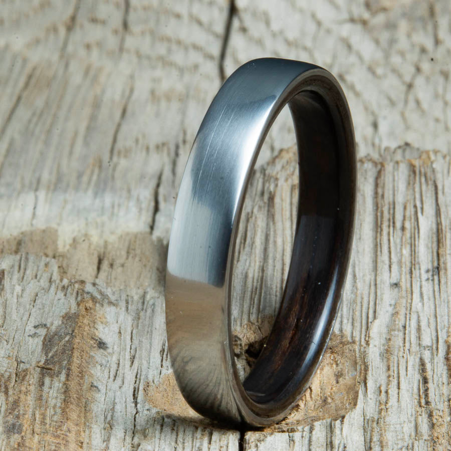 Ebony lined womens wood ring with satin titanium. Custom handcrafted womens wooden rings are made by Peacefield Titanium