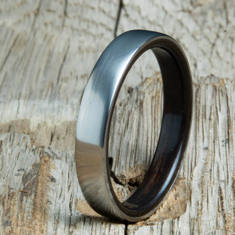 Ebony lined womens wood ring with satin titanium. Custom handcrafted womens wooden rings are made by Peacefield Titanium