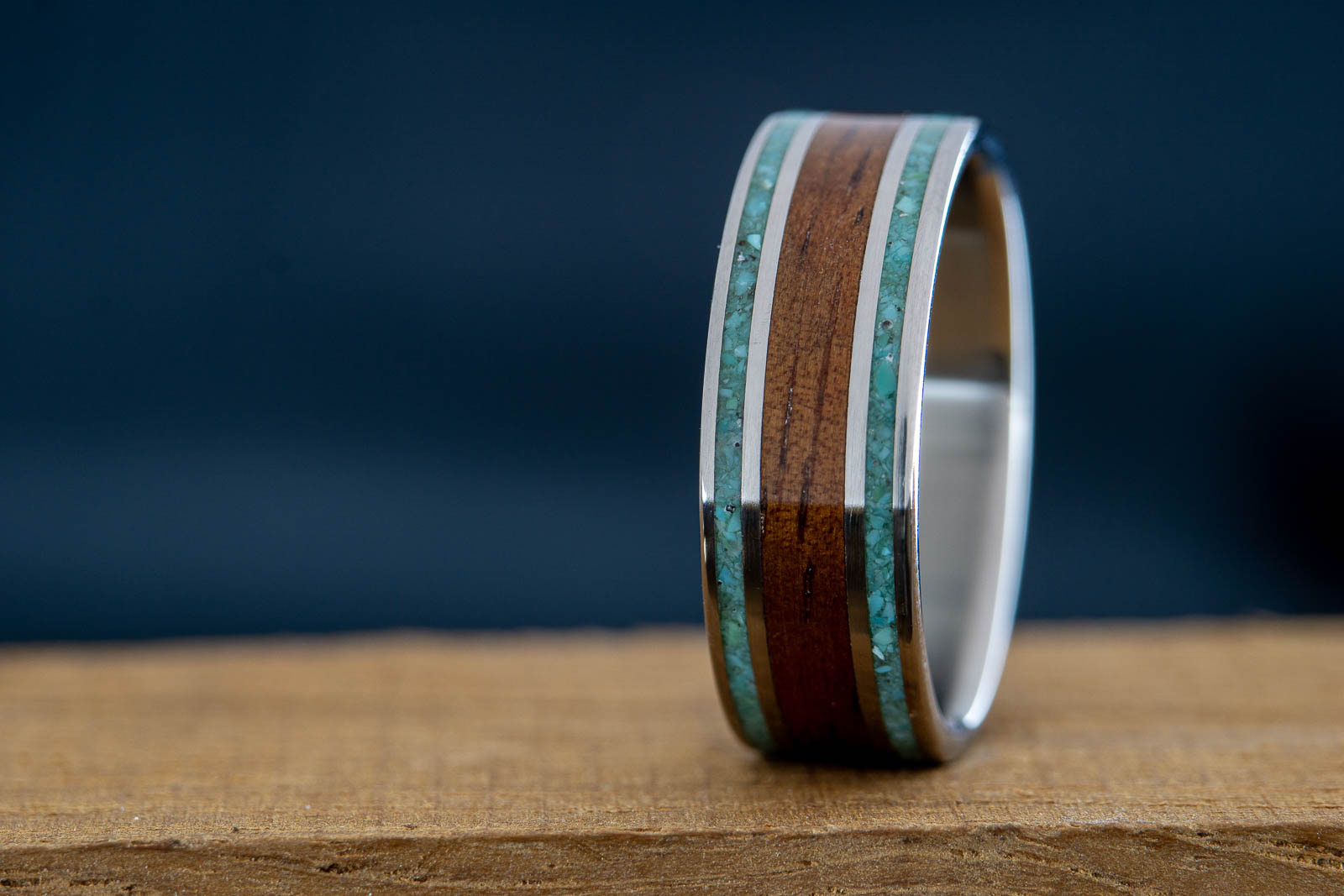 titanium wedding band with koa wood and turquoise inlay