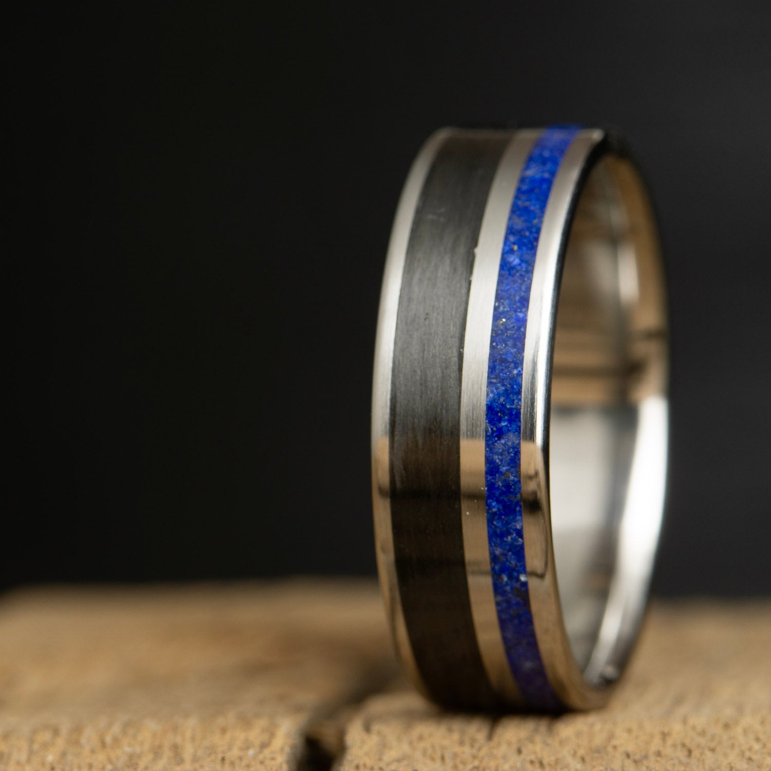 titanium ring with lapis and carbon fiber