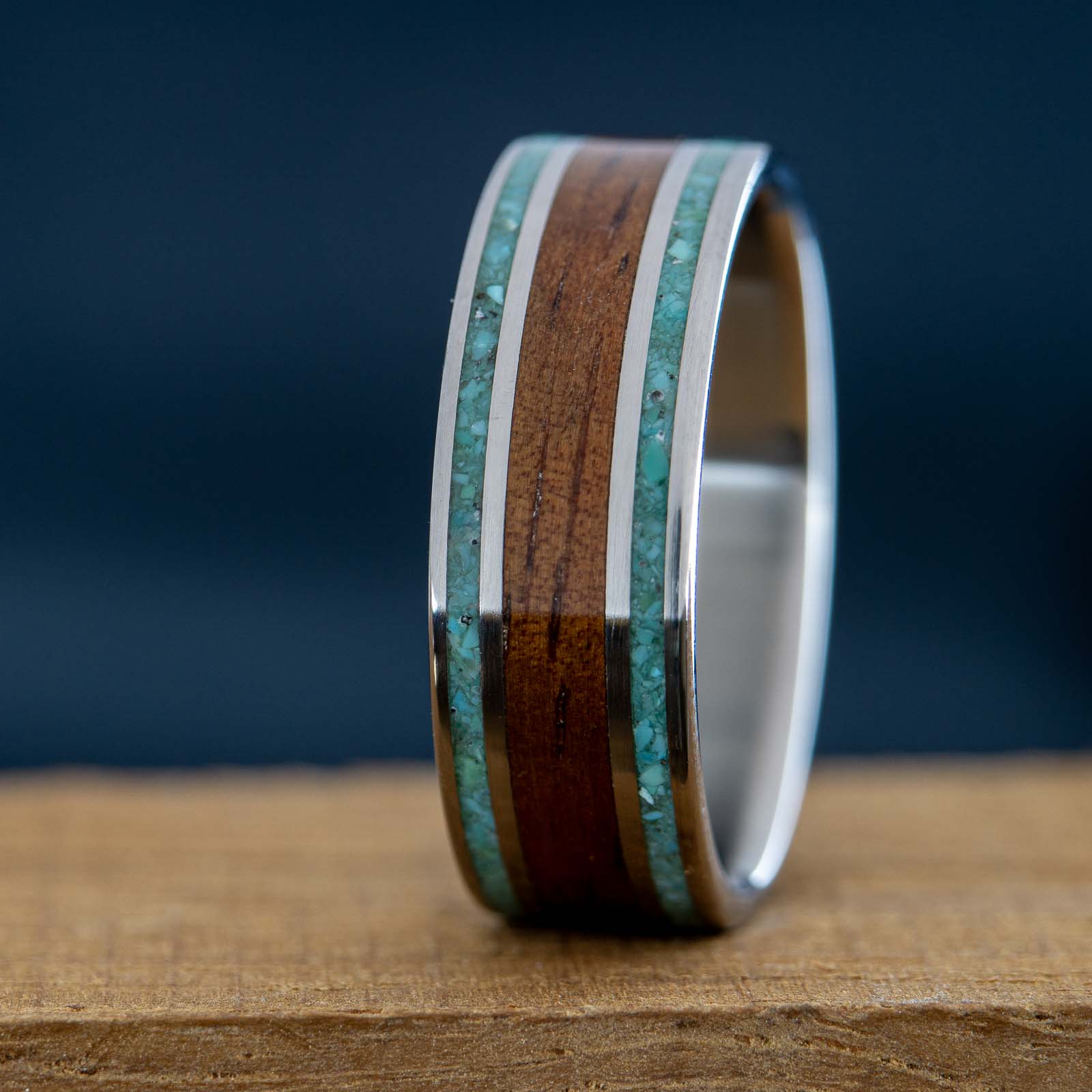 titanium wedding band with koa wood and turquoise inlay