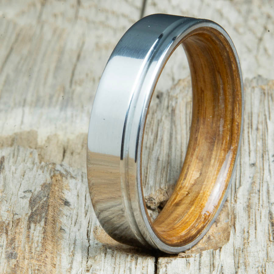 Titanium wedding bands with Whiskey barrel interior. Unique handcrafted rings and bands made by Peacefield Titanium.