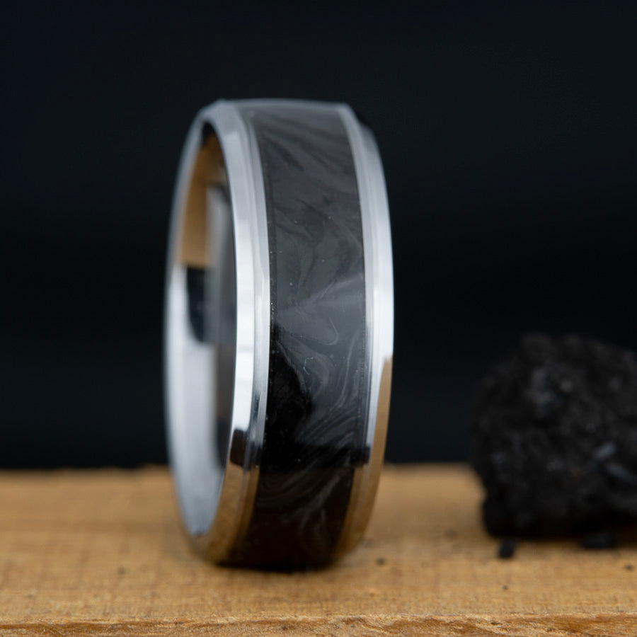 Forged carbon inlay on tungsten ring