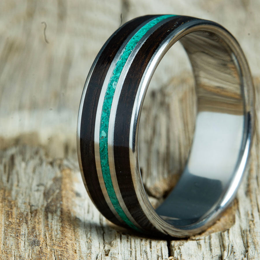 Wood ring for men with Ebony wood and Malachite stone on polished titanium custom made by Peacefield Titanium.