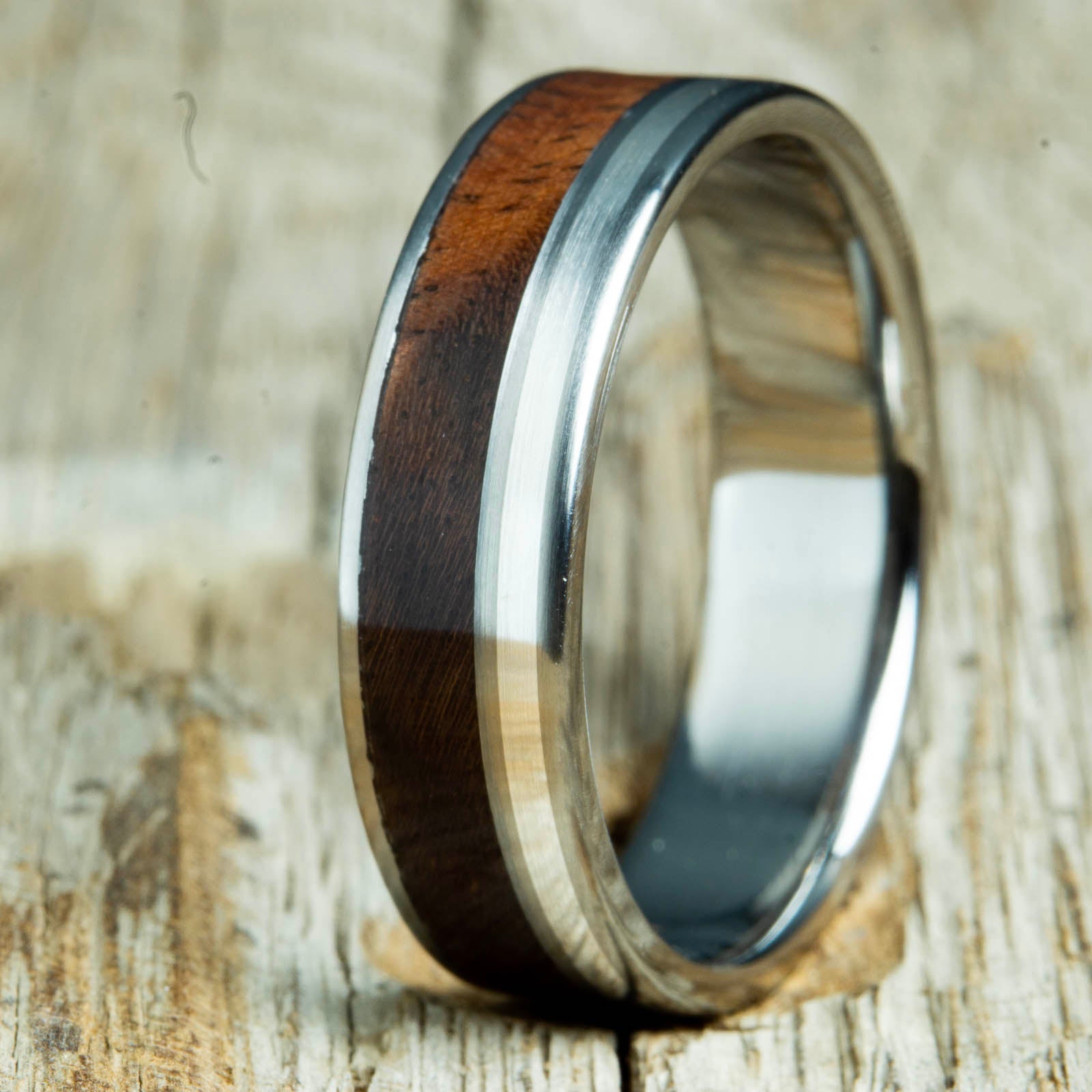Walnut wood ring with silver pinstripe on polished titanium custom ring by Peacefield Titanium