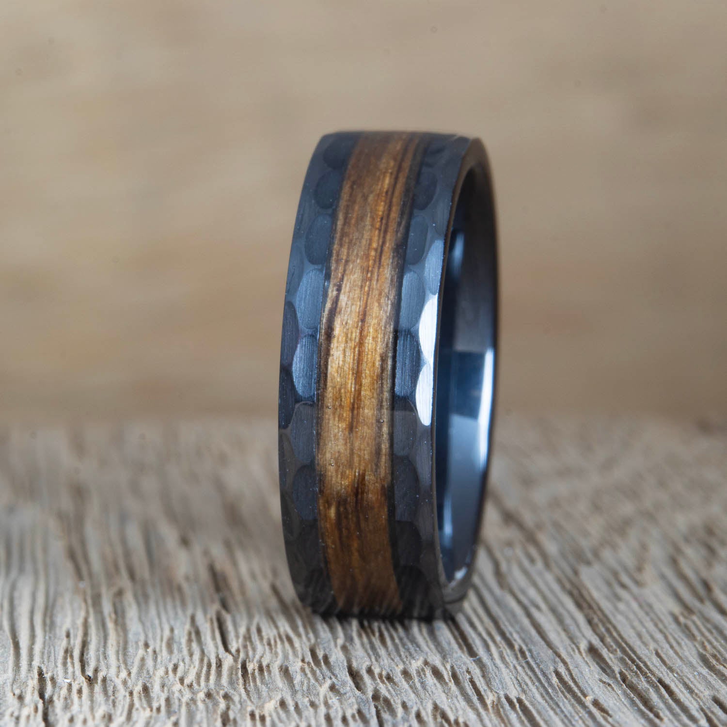 the whiskey hammered- black wedding band with whiskey barrel wood inlay