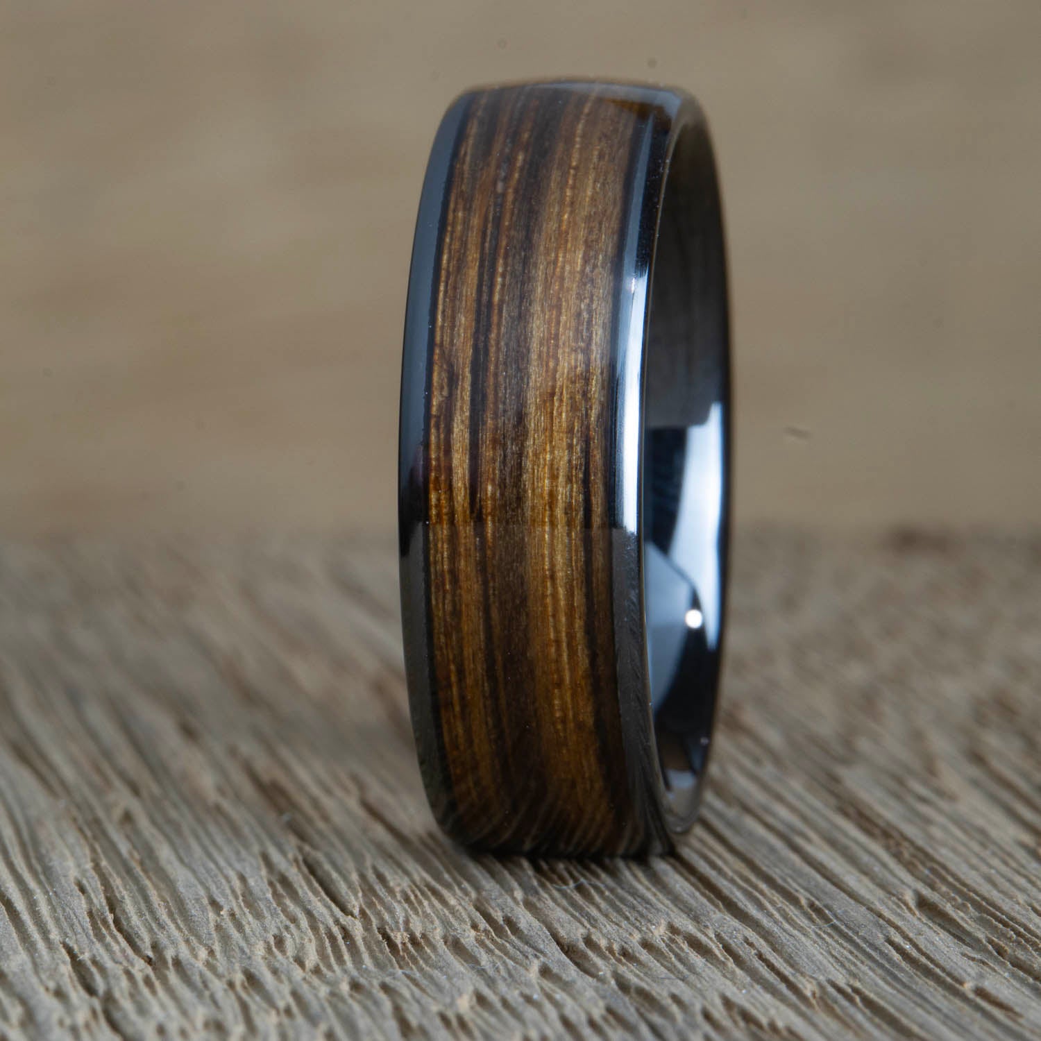 black ring with whiskey barrel wood inlay