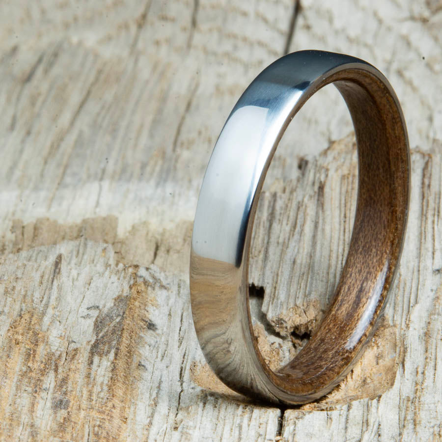 Classic domed womens wood wedding band with Walnut wood. Unique wooden rings for women made by Peacefield Titanium.