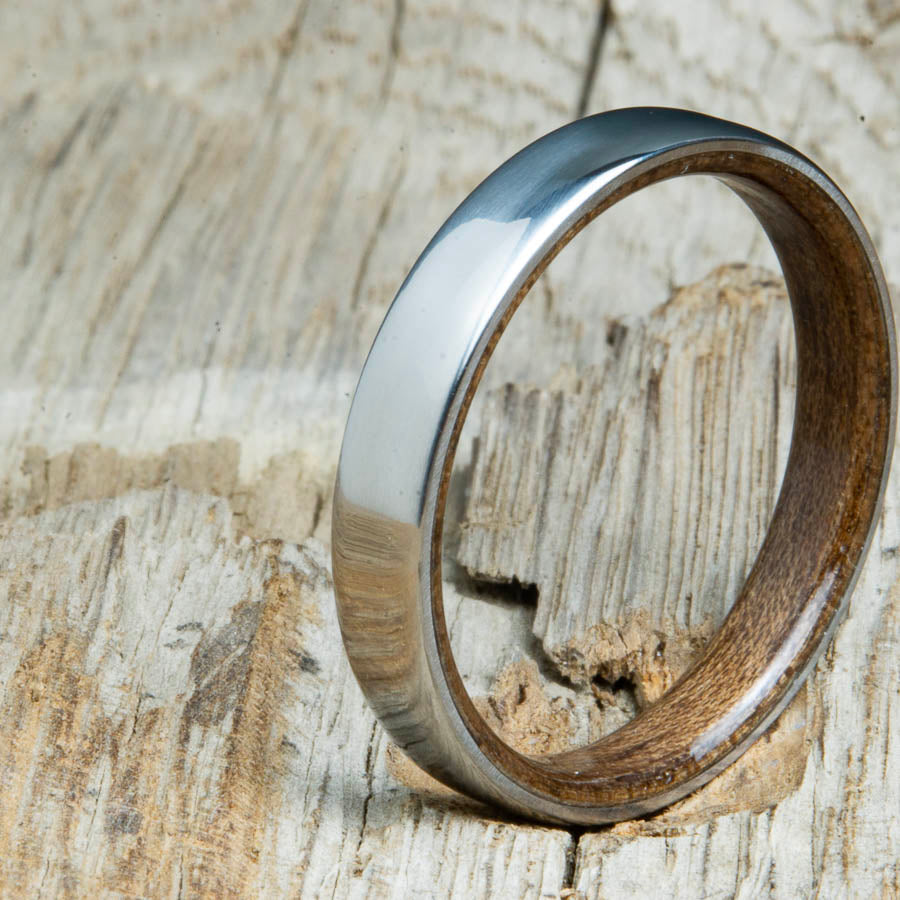 Classic domed womens wood wedding band with Walnut wood. Unique wooden rings for women made by Peacefield Titanium.