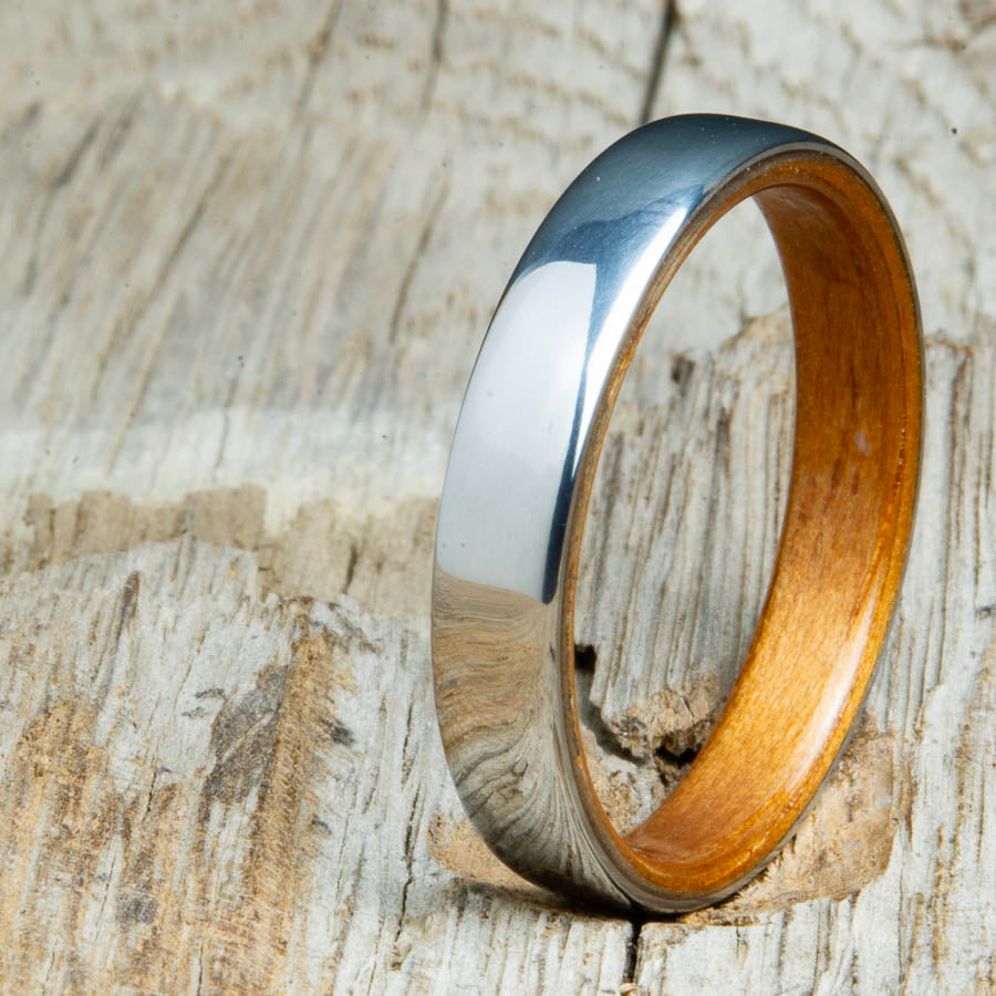 Classic domed womens wood wedding band with Koa wood. Unique wooden rings for women made by Peacefield Titanium.