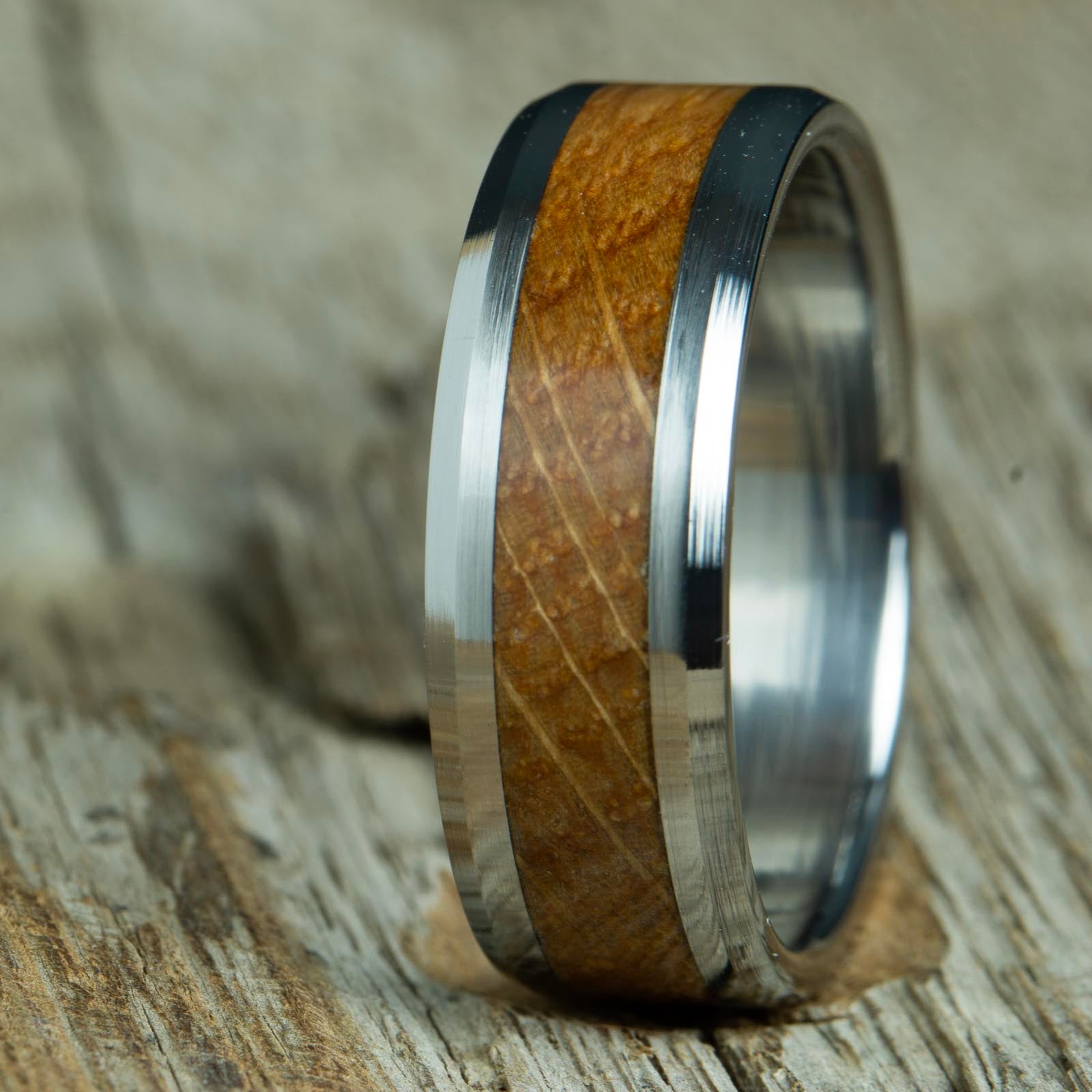 Whiskey barrel wood rings with polished titanium 