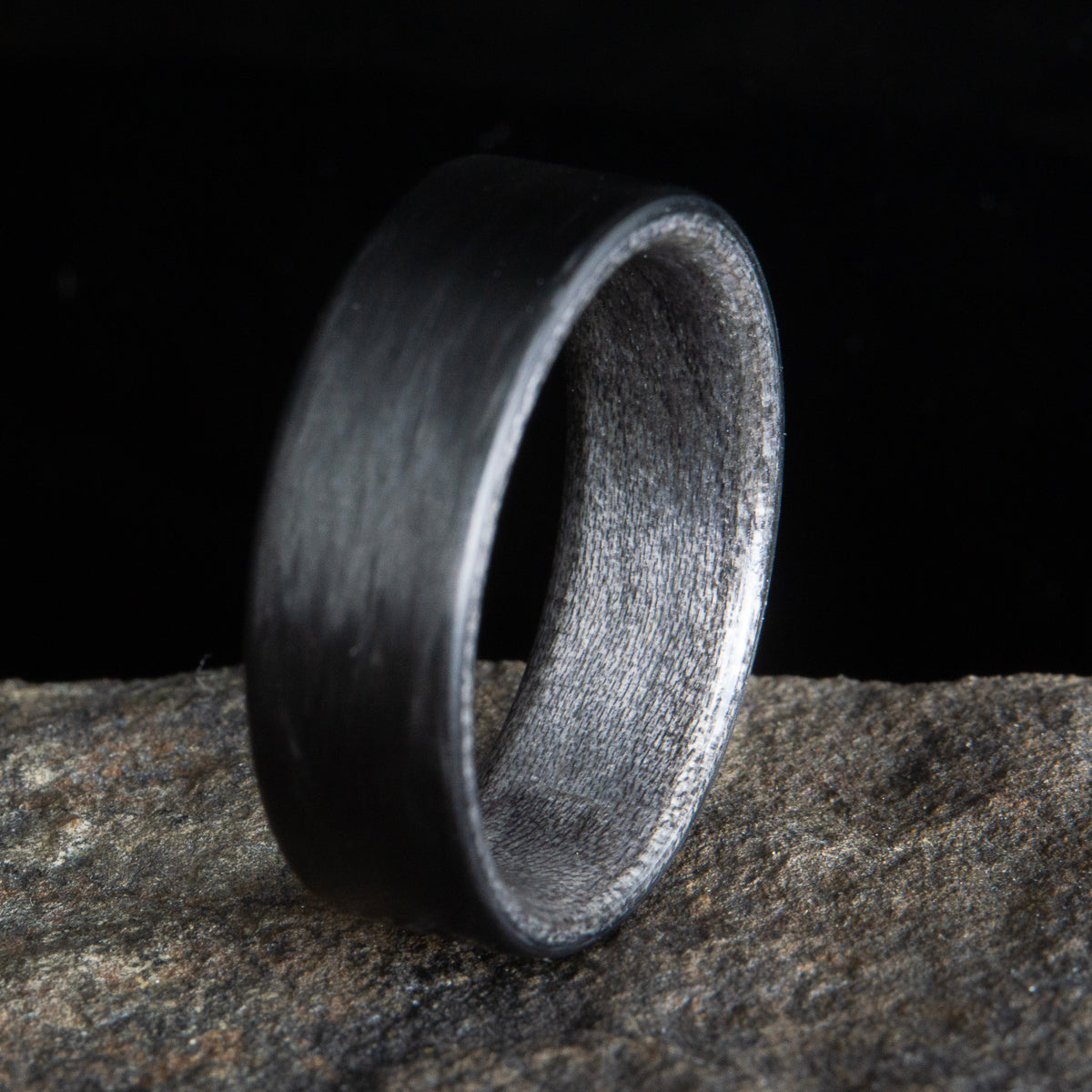 black carbon fiber ring with grey barn wood