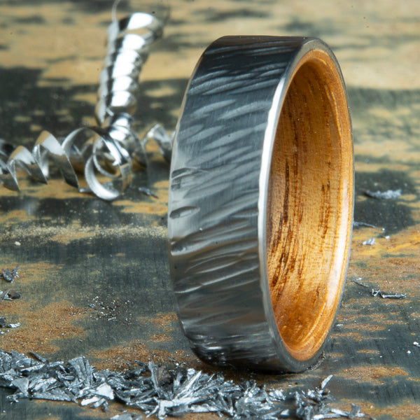 Koa wood ring with hammer forged titanium