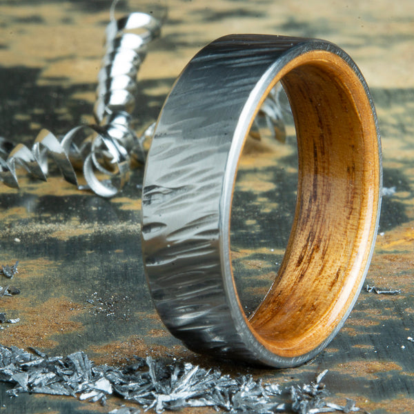Koa wood lined hammered titanium ring