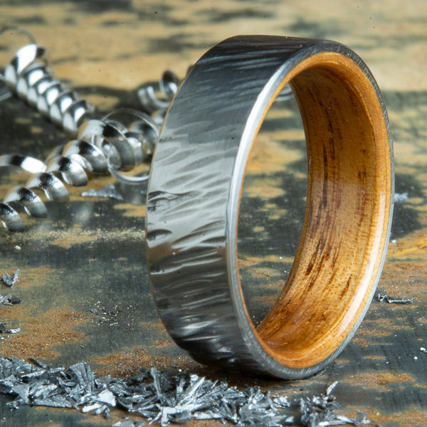 Koa wood ring with hammer forged titanium
