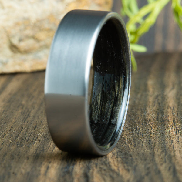 Titanium wood rings by Peacefield Titanium. Aged Whiskey barrel wood lined titanium ring