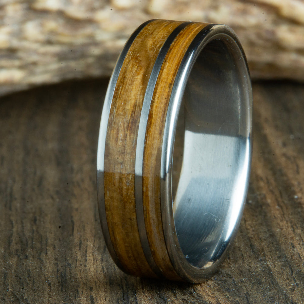 Titanium ring made with Whiskey barrel wood