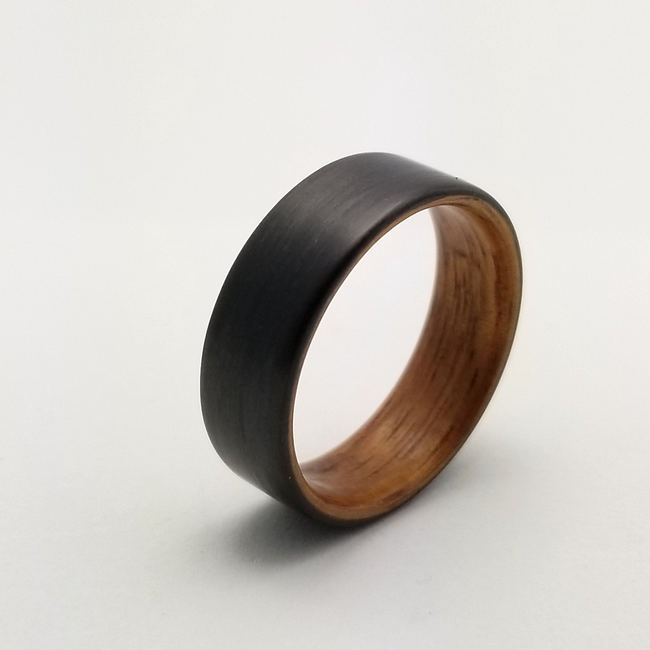 black carbon ring with koa wood interior